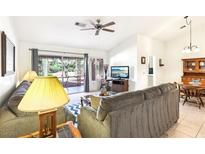 Bright living room features neutral tones, patio access, and a ceiling fan at 3013 Sungold Dr, Las Vegas, NV 89134