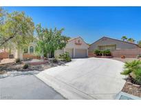 Charming one-story home with a two-car garage, desert landscaping, and a spacious driveway at 4197 Bottiglia Ave, Las Vegas, NV 89141