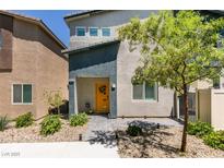 Charming two-story home with a welcoming yellow front door and well-maintained landscaping at 4519 Sapphire Moon Ave, North Las Vegas, NV 89084
