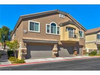 Beautiful two-story home with a two-car garage, stucco exterior, and private balcony in a well-kept neighborhood at 4779 Straight Flush Dr # 103, Las Vegas, NV 89122