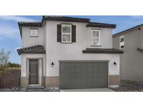 Charming two-story home featuring a gray garage door, tile roof, and decorative shutters, enhancing curb appeal at 5163 Capucina St # Lot 3, Las Vegas, NV 89122