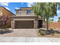 Charming two-story home featuring a two-car garage and nicely landscaped front yard with mature trees at 6783 Pleasant Flower St, Las Vegas, NV 89149
