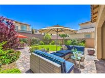 Inviting backyard features comfortable seating, lush lawn, and mature landscaping at 12286 Silvana St, Las Vegas, NV 89141