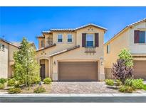 Charming two-story home showcasing a well-manicured front yard and a two-car garage for convenient parking at 12286 Silvana St, Las Vegas, NV 89141