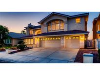 Stunning two-story home boasting a three-car garage and well-maintained landscaping at 2448 Ram Crossing Way, Henderson, NV 89074