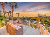 Enjoy scenic views from this cozy balcony with comfortable seating and a warming heater at 3050 Whispering Crest Dr, Henderson, NV 89052