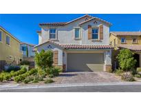 Charming two-story home with a two-car garage and a beautifully landscaped front yard at 459 Astillero St, Las Vegas, NV 89138