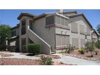Two-story condo with covered patio and desert landscaping at 5710 E Tropicana Ave # 1114, Las Vegas, NV 89122