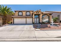 Charming two-story home featuring a three-car garage and inviting front yard with decorative fountain at 6 High Sierra Dr, Henderson, NV 89074