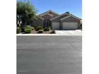 Charming single-story home with a two-car garage and manicured landscaping in a quiet neighborhood at 6712 Tattler Dr, North Las Vegas, NV 89084