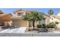 Two-story home featuring a neutral stucco exterior, clay tile roof, and attached two-car garage at 9428 Sierra Summit Ave, Las Vegas, NV 89134