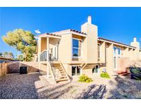 Charming two-story home with a stucco exterior, desert landscaping, and a welcoming entrance at 1308 Capri Dr # D, Boulder City, NV 89005