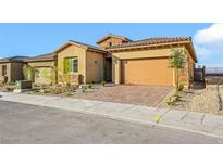 Charming single-story home with a two-car garage and landscaped front yard at 164 Cabo Cruces Dr, Henderson, NV 89011