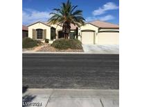 Charming single-story home featuring a 2-car garage and desert landscaping at 2175 Clearwater Lake Dr, Henderson, NV 89044