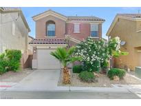 Charming two-story home with a well-manicured front yard and attached garage at 439 Royal Bridge Dr, Las Vegas, NV 89178