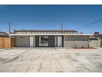 Home with modern exterior features a spacious parking area and decorative rock accents at 4558 Sheppard Dr, Las Vegas, NV 89122