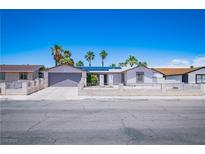 Charming single-story home featuring a two-car garage, desert landscaping, and a secure fenced yard at 4742 Monterrey Ave, Las Vegas, NV 89121
