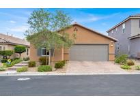 Charming single-story home with desert landscaping, a brick-paved driveway, and a neutral stucco exterior at 759 Star Apple Ln, Las Vegas, NV 89178