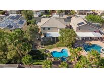 Wonderful aerial view of a home with a sparkling pool, patio, and meticulous landscaping at 8121 Eagle Clan Ct, Las Vegas, NV 89131