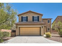 Charming two-story home with a two-car garage, dark shutters, and neutral stucco under a clear blue sky at 8252 Pearl Oasis Ct, Las Vegas, NV 89139