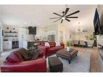 Open-concept living room with a ceiling fan, recessed lights, and modern furnishings at 9705 Standard Ave, Las Vegas, NV 89129