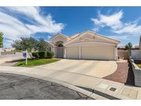 Charming single-story home with a well-manicured lawn, desert landscaping, and two-car garage at 1017 Guided Dancer Ave, Henderson, NV 89015