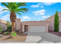 Charming single-story home with a well-maintained yard and attached two car garage at 104 Hutton Ln, Las Vegas, NV 89145