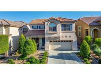 Charming two-story home features a well-manicured yard, two-car garage, and elegant architectural details at 10749 Turquoise Valley Dr, Las Vegas, NV 89144