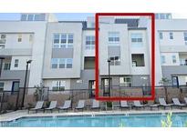 Modern condo with a pool view and outdoor lounge area with many windows for natural light at 2507 Silent View Ave, Henderson, NV 89044