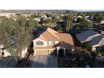 Charming two-story home featuring a beautiful terracotta-tiled roof and attached two-car garage at 2549 Sundew Ave, Henderson, NV 89052