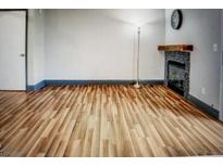 Bright living room with wood floors and a fireplace at 3150 Soft Breezes Dr # 1033, Las Vegas, NV 89128