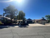 Charming single-story home featuring desert landscaping, a paved driveway, and a secure fenced yard at 3920 Aspencrest Dr, Las Vegas, NV 89108