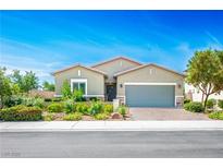 Charming single-story home featuring a well-maintained landscape and a two-car garage at 393 Mullen Ave, Henderson, NV 89044