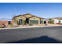 Charming single-story home featuring a well-kept yard and a spacious three-car garage at 42 Late Harvest Ave, Pahrump, NV 89060
