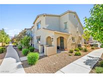 Inviting two-story home features a charming facade, manicured landscaping, and a welcoming entryway for great curb appeal at 6425 Classic Ridge St, North Las Vegas, NV 89086