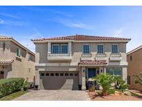 Two-story home featuring a well-manicured front yard and a two car garage at 6540 W Cougar Ave, Las Vegas, NV 89139