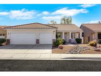 Charming single-story home featuring a two-car garage, neutral paint, and landscaped front yard at 8849 Pheasant Valley Way, Las Vegas, NV 89123