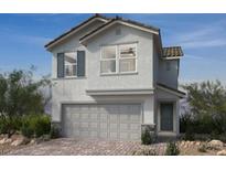 Charming two-story home featuring a two-car garage, neutral paint and simple, clean landscaping at 9246 Dekalb Ct, Las Vegas, NV 89148