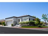 Charming corner lot home with a well-manicured lawn and attached two-car garage at 10532 Redwood Ash Ave, Las Vegas, NV 89144