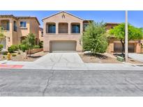 Charming two-story home featuring a desert landscape and a two-car attached garage at 11816 Orense Dr, Las Vegas, NV 89138