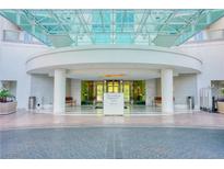Elegant building entrance featuring valet, modern architecture, and ample seating in a refined environment at 222 Karen Ave # 2506, Las Vegas, NV 89109