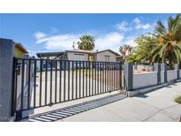 View of the front of the property highlighting the gated front yard for security and privacy at 237 Cervantes St, Las Vegas, NV 89101