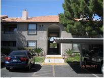 Attractive two-story condo building with covered parking and well-maintained landscaping at 2606 S Durango Dr # 176, Las Vegas, NV 89117