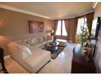 Inviting living room features a comfortable sectional sofa, stylish decor, and abundant natural light at 270 E Flamingo Rd # 319, Las Vegas, NV 89169