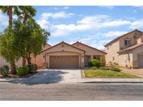 Charming single-story home features a two car garage and well maintained landscaping at 2825 Shayla Bay Ave, North Las Vegas, NV 89086