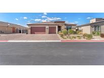 Charming single-story home with a three-car garage, stone accents, and well-maintained landscaping at 4510 Rubious Ave, North Las Vegas, NV 89084