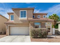 Charming two-story home featuring a well-maintained front yard and attached two-car garage at 4622 English Lavender Ave, North Las Vegas, NV 89031