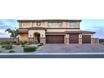 Stunning two-story home featuring a spacious three-car garage and meticulously landscaped front yard at 5328 Hickory Tree St, Las Vegas, NV 89149