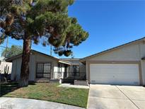 Charming single-story home with desert landscaping and a two-car garage, set under a clear blue sky at 5720 Goldmount Ave, Las Vegas, NV 89107
