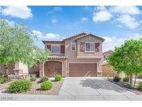 Charming two-story home featuring a finished two car garage, desert landscaping and a welcoming facade at 7300 Lavender Rose Ave, Las Vegas, NV 89117
